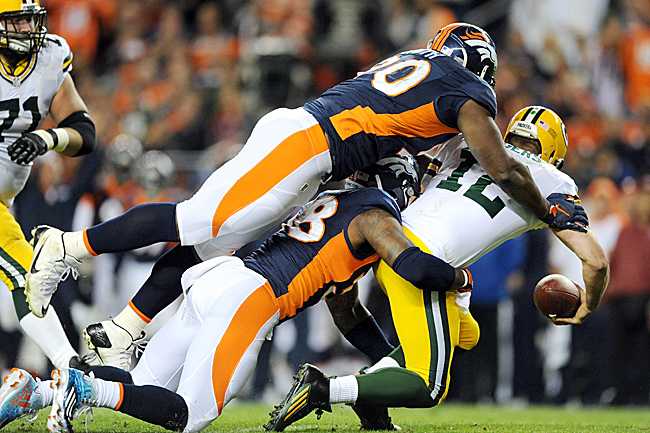 His receivers unable to get open, Aaron Rodgers had little time to improvise against the Broncos’ top-notch pass rush.